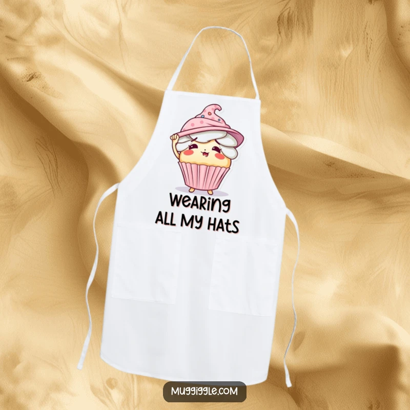 Funny apron showing a flustered cupcake character comically overwhelmed by an abundance of hats.