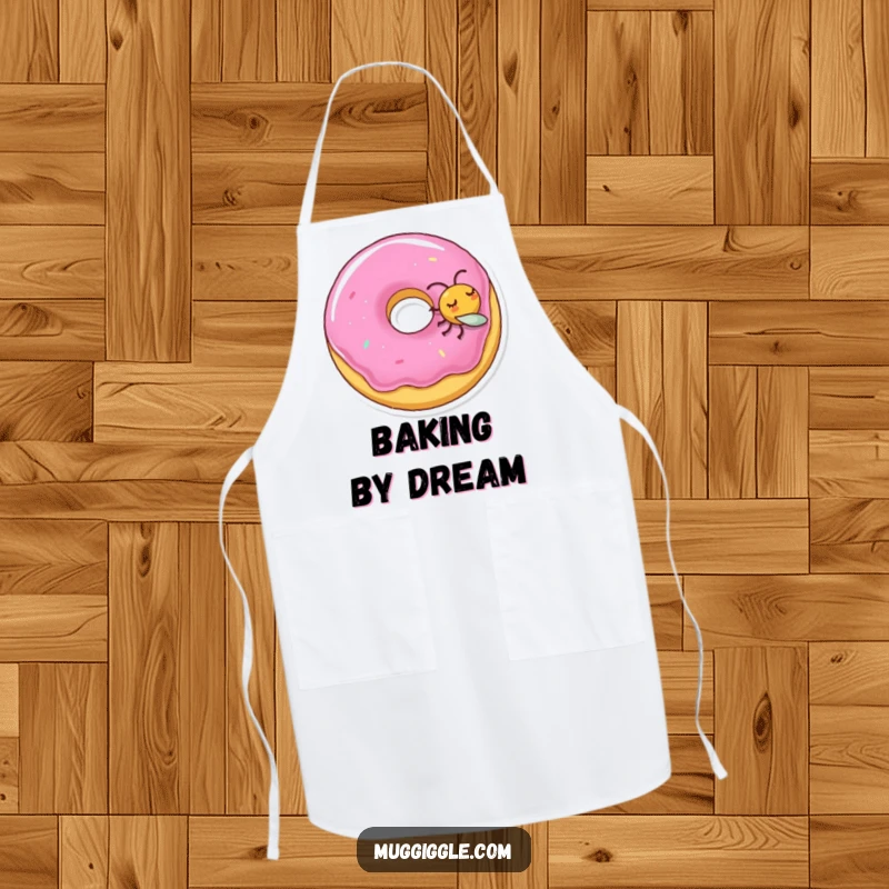 Funny apron showing a sleeping donut character being nudged by a mischievous fly, adding kitchen humor.