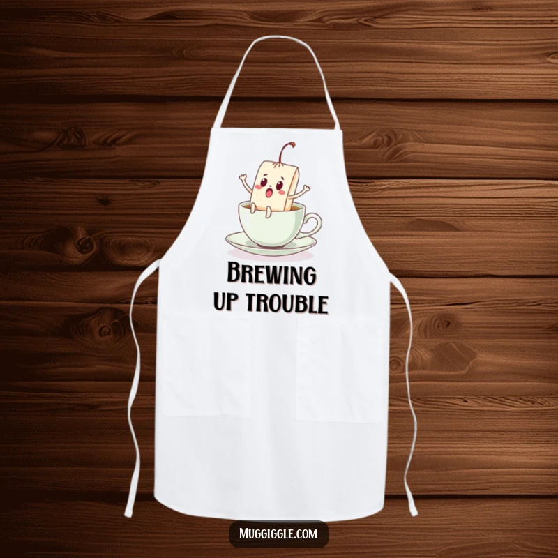 Funny apron featuring a surprised teabag with legs kicking, escaping a teacup, a humorous and functional kitchen accessory.