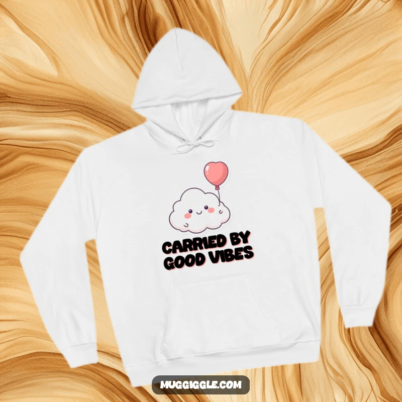 Funny hoodie featuring a smiling cloud character happily floating away, attached to a runaway balloon, perfect for cozy dreams.
