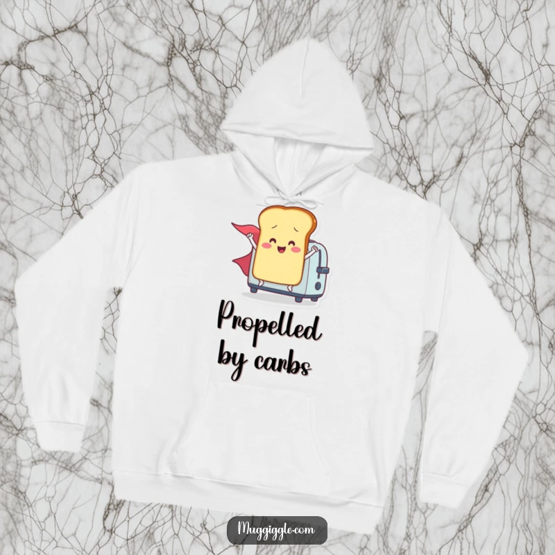 Funny hoodie featuring a smiling toast character with a flowing cape, launched from a toaster, ready to save the day in comfort.