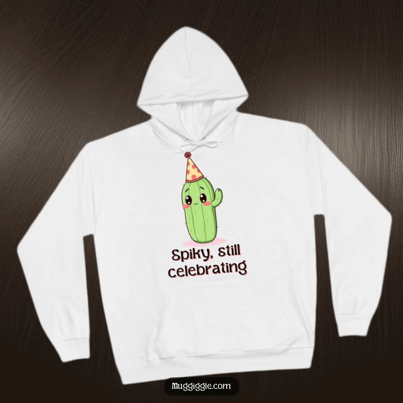 Funny Hoodie: Surprised cactus character wearing a tiny party hat, radiating playful shock.