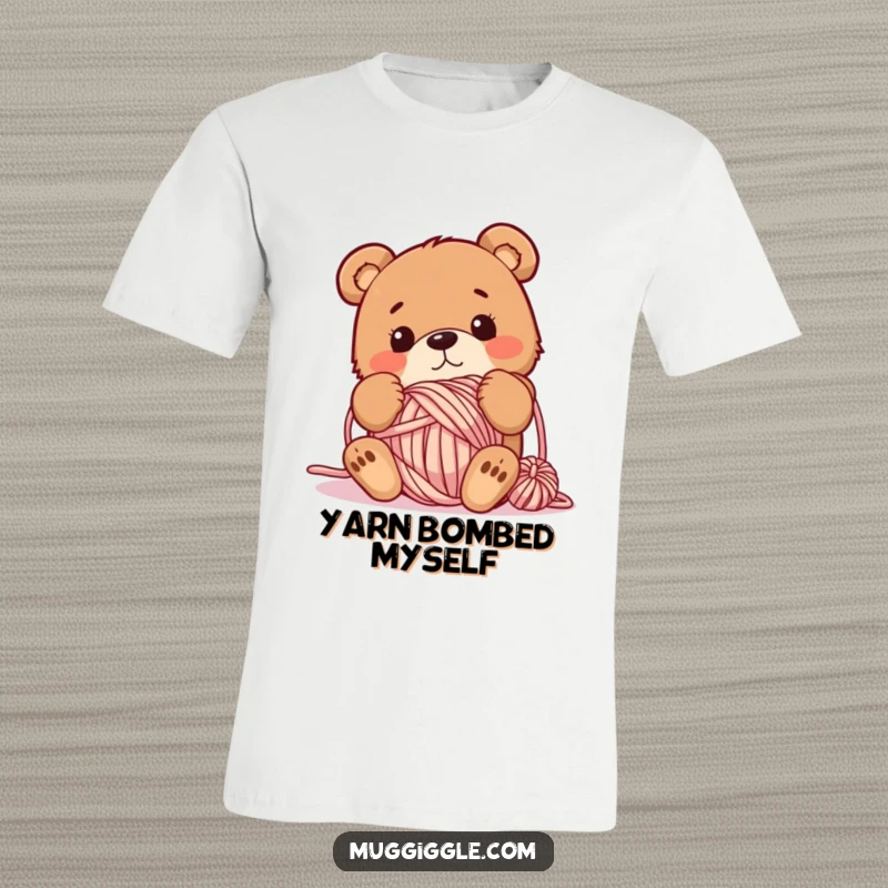 Funny t-shirt featuring a bewildered bear hopelessly tangled in a large ball of yarn, perfect for expressing a clumsy or crafty personality.